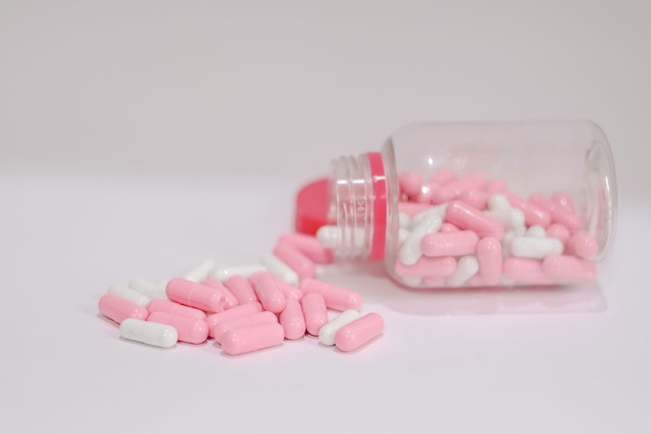 Bottle of oxycodone pills used for chronic pain management on a table