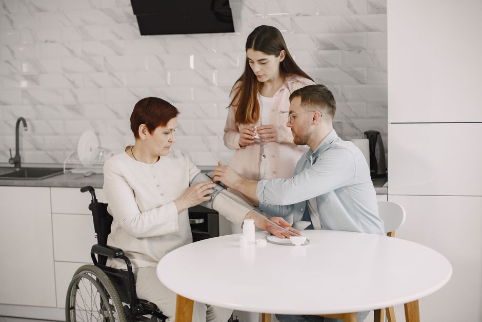 Caregiver helping an older adult review oxycodone medication safely at home