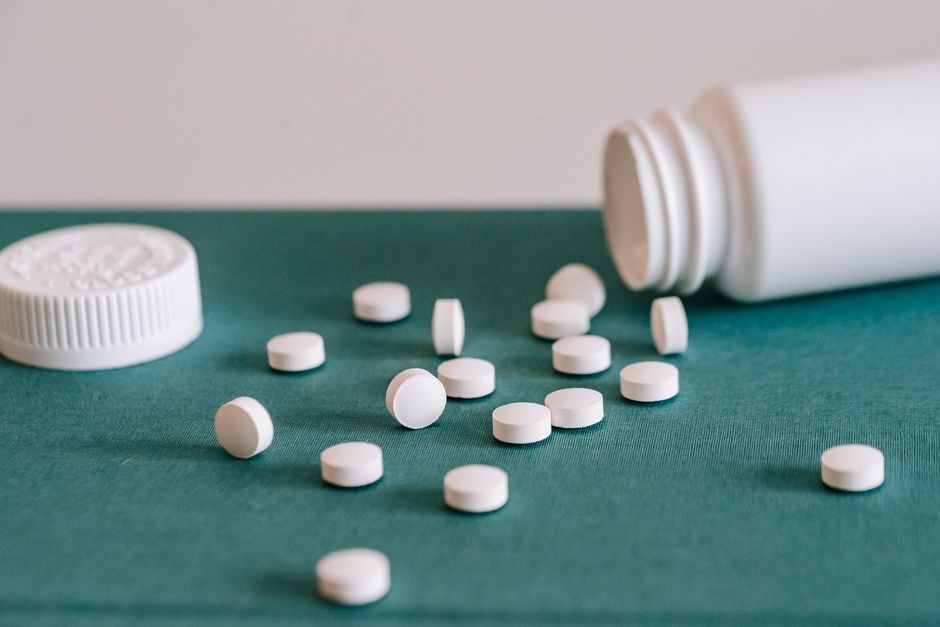 Imodium and oxycodone pill bottles next to each other representing drug interaction safety