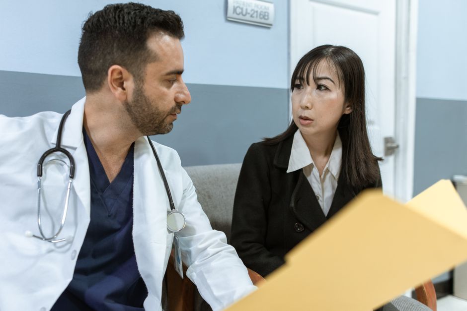 Patient discussing oxycodone treatment with doctor during a medical appointment