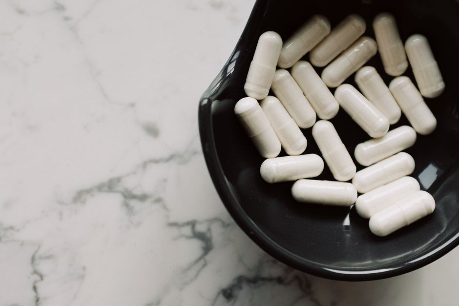 Person experiencing abdominal discomfort from oxycodone-related constipation