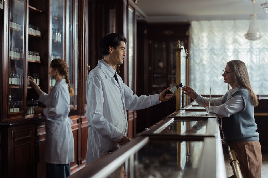 Pharmacist discussing oxycodone prescription questions with a patient