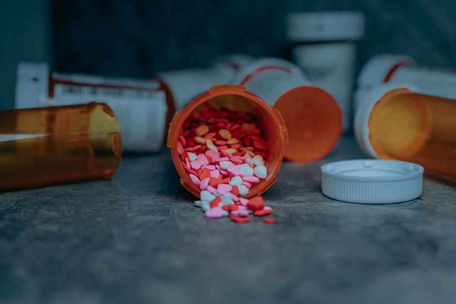 Pharmacist reviewing an oxycodone prescription bottle for a California patient