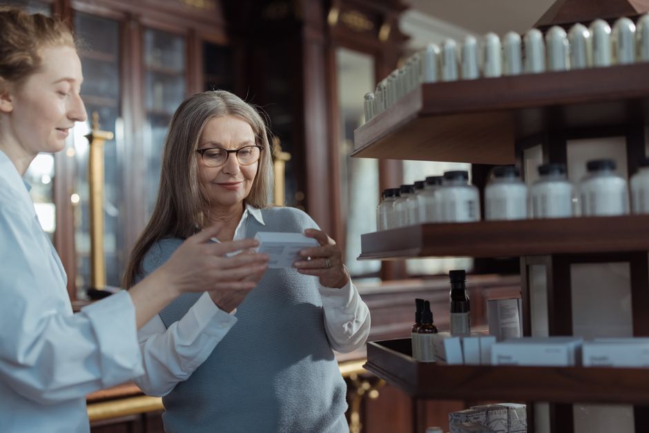 Pharmacist reviewing an oxycodone prescription with a patient in New York