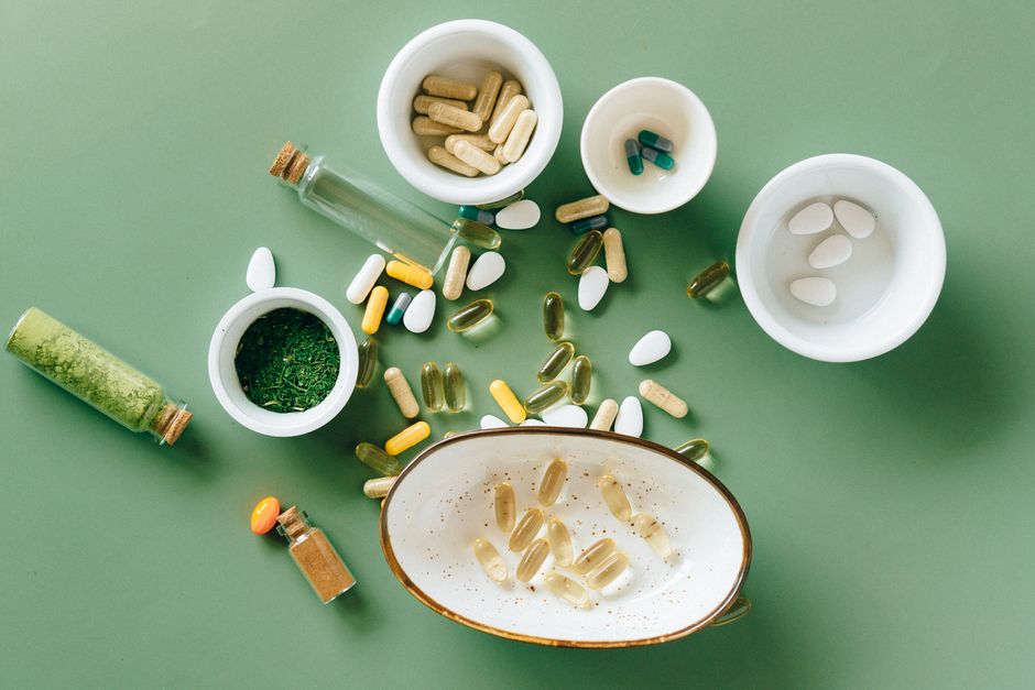 A cup of coffee next to hydrocodone pills representing the interaction between hydrocodone and caffeine
